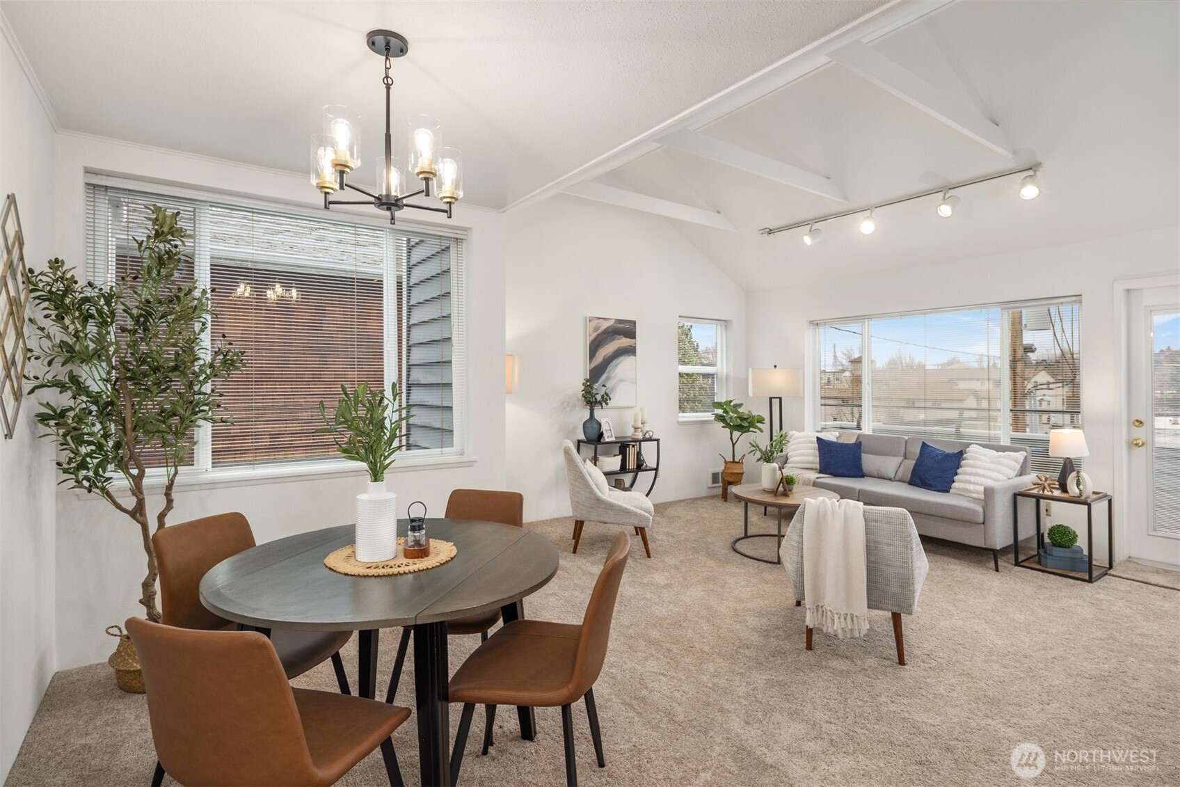 57 Etruria Street, Unit 201 Seattle, WA 98109 - Photo 6 of 26 a view of a dining room with furniture window and outside view