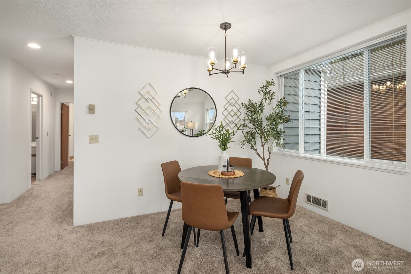 57 Etruria Street, Unit 201 Seattle, WA 98109 - Photo 8 of 26 a view of a dining room with furniture and chandelier
