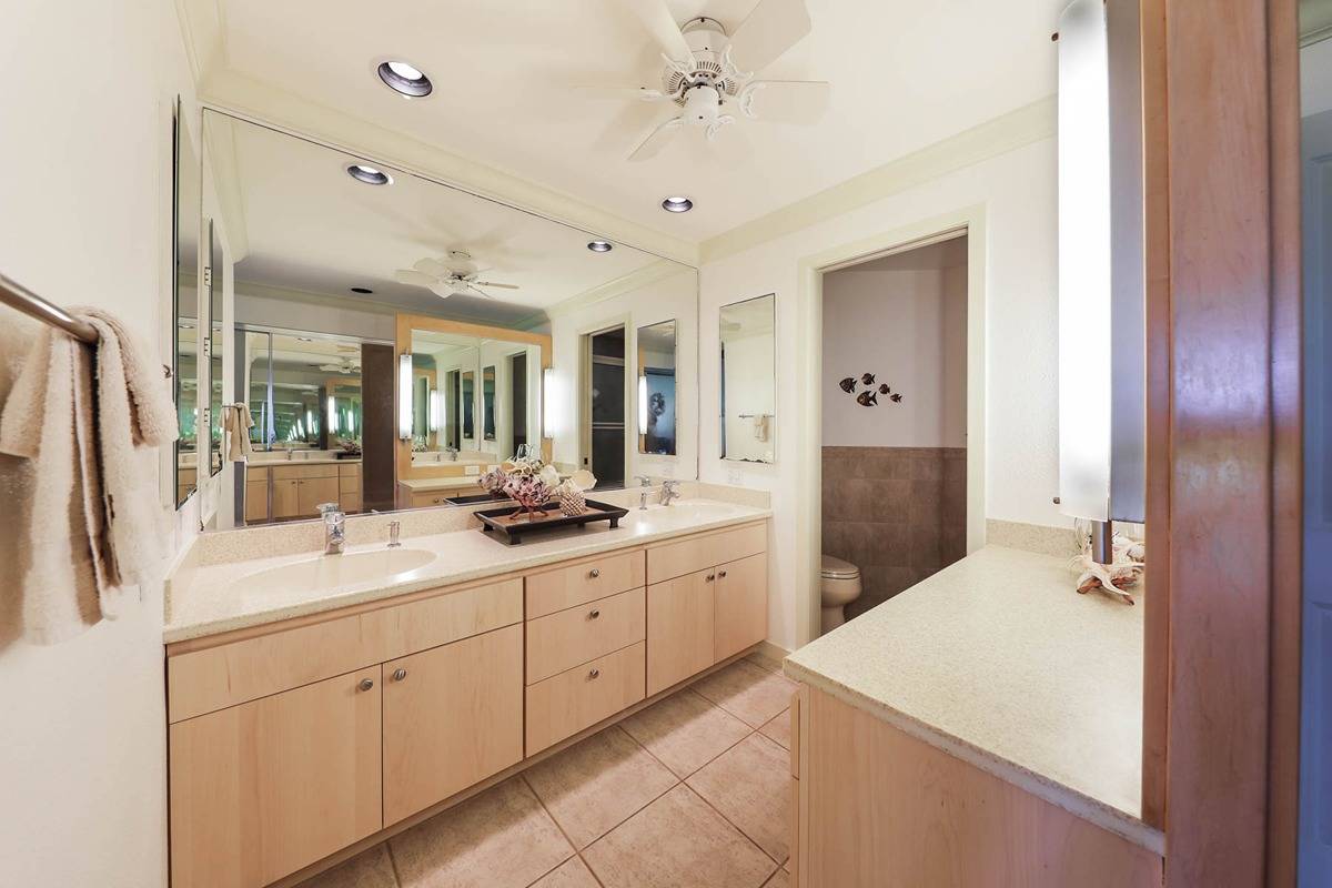 1565 Pe'e Road, Unit 514 Koloa, HI 96756 - Photo 17 of 28 a spacious bathroom with a double vanity sink mirror and