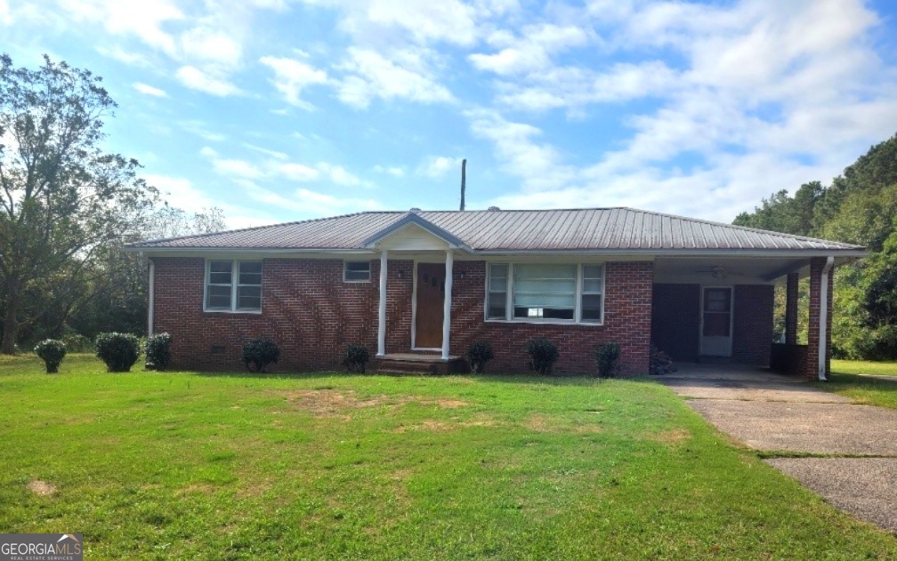 a front view of a house with garden and porch