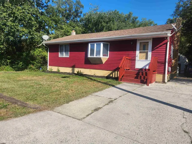 a front view of a house with yard