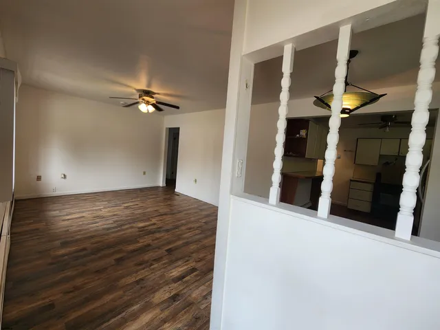 a view of a livingroom with wooden floor