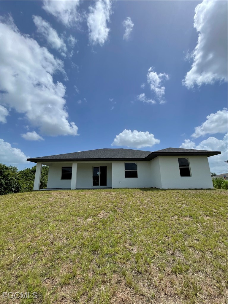 4308 15th Street Southwest Lehigh Acres, FL 33976 - Photo 27 of 27 a view of house with yard