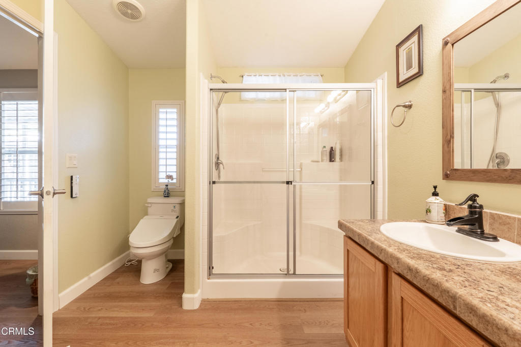 1273 South Rice Road, Unit 12 Ojai, CA 93023 - Photo 16 of 27 a bathroom with a granite countertop sink toilet and shower