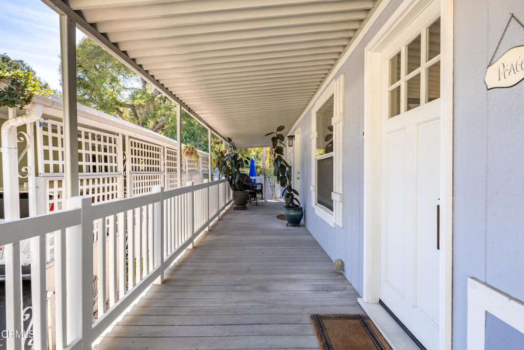 1273 South Rice Road, Unit 12 Ojai, CA 93023 - Photo 20 of 27 a view of a porch with wooden floor and stairs