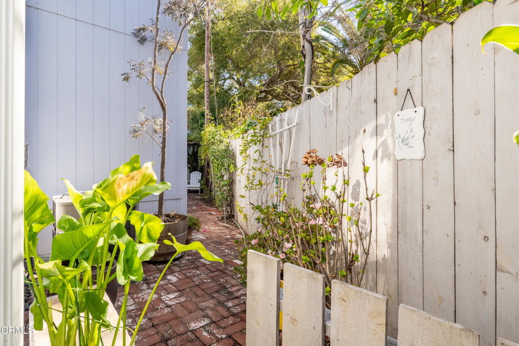 1273 South Rice Road, Unit 12 Ojai, CA 93023 - Photo 23 of 27 a view of path along with wooden door and flowers