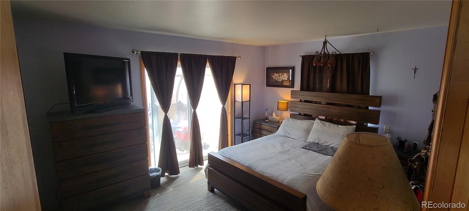 445 Rosalie Road Bailey, CO 80421 - Photo 16 of 21 a bedroom with a bed and a television