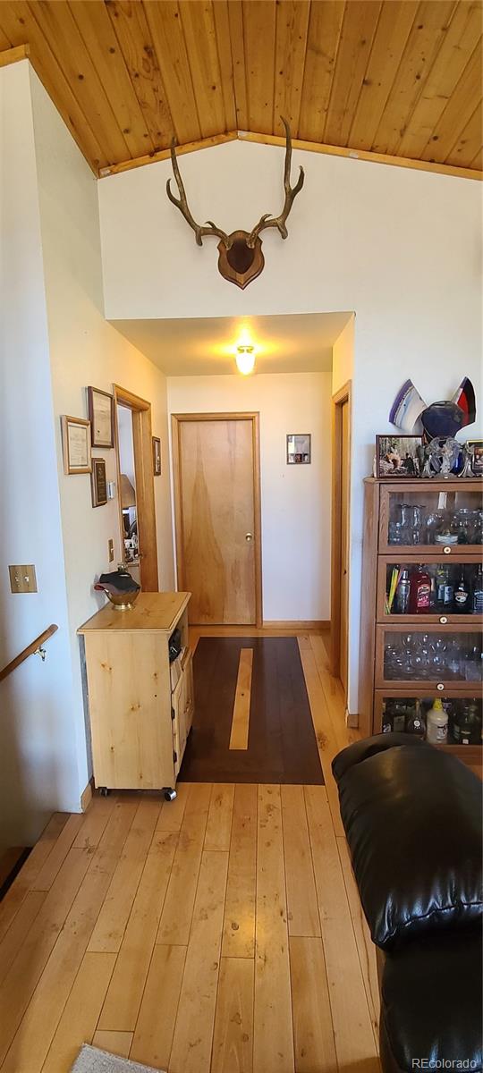 445 Rosalie Road Bailey, CO 80421 - Photo 6 of 21 a bedroom with a bed and a dresser