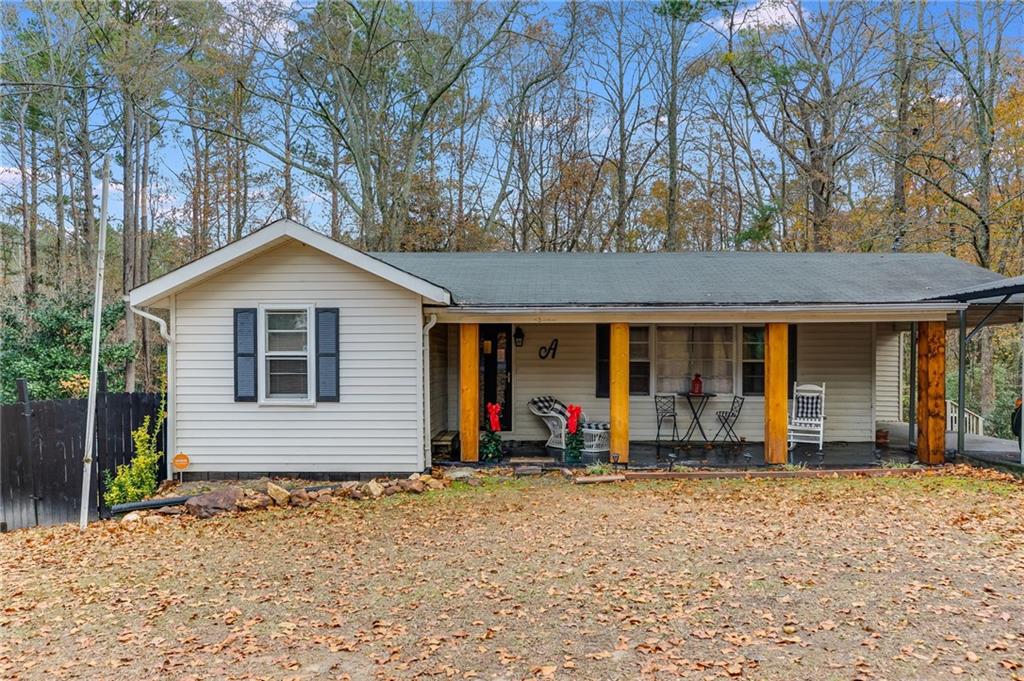 a view of a house with a backyard