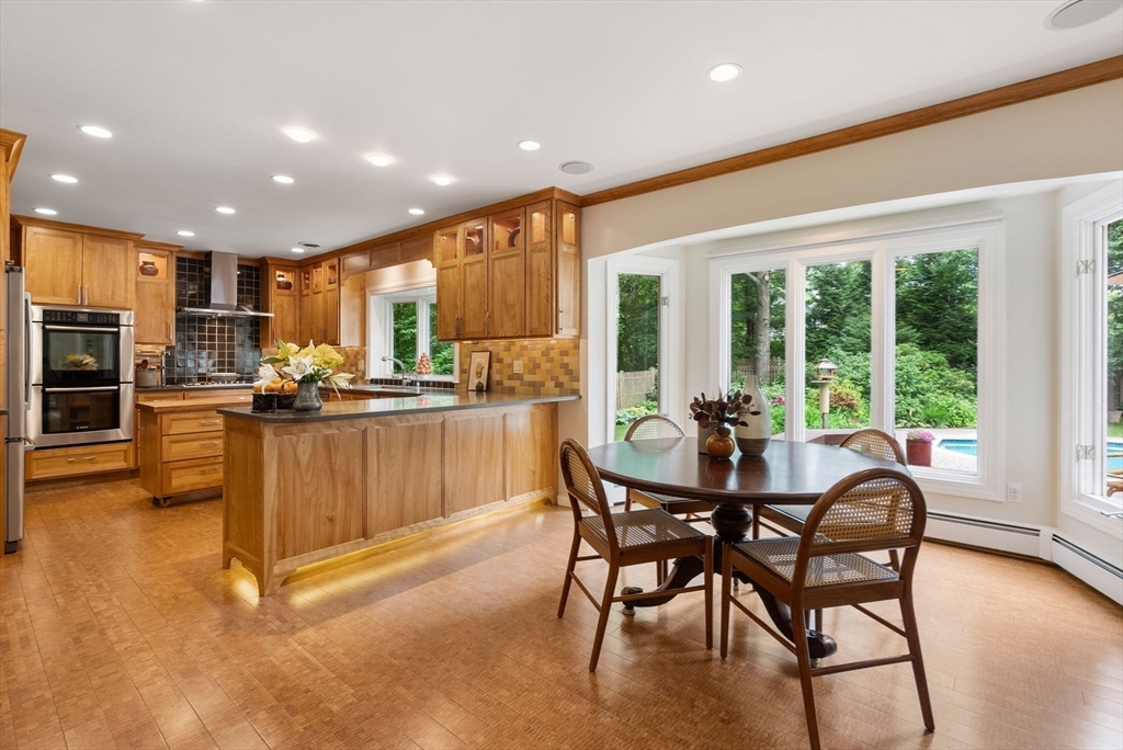 120 Lincoln Road Wayland, MA 01778 - Photo 12 of 34 a view of a dining room with furniture kitchen and chandelier