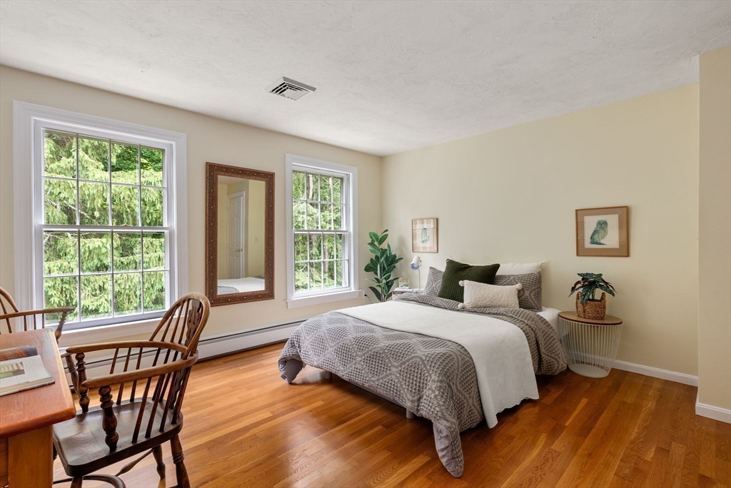 120 Lincoln Road Wayland, MA 01778 - Photo 25 of 34 a bedroom with a bed and windows