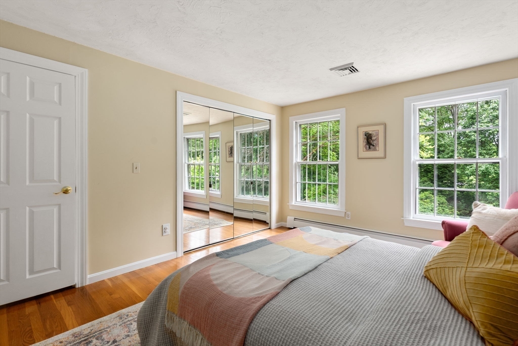 120 Lincoln Road Wayland, MA 01778 - Photo 27 of 34 a bed sitting in a bedroom next to a window