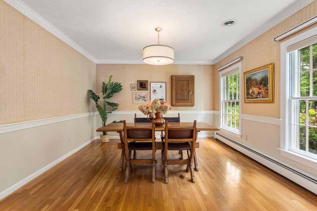 120 Lincoln Road Wayland, MA 01778 - Photo 8 of 34 a view of a dining room with furniture window and wooden floor