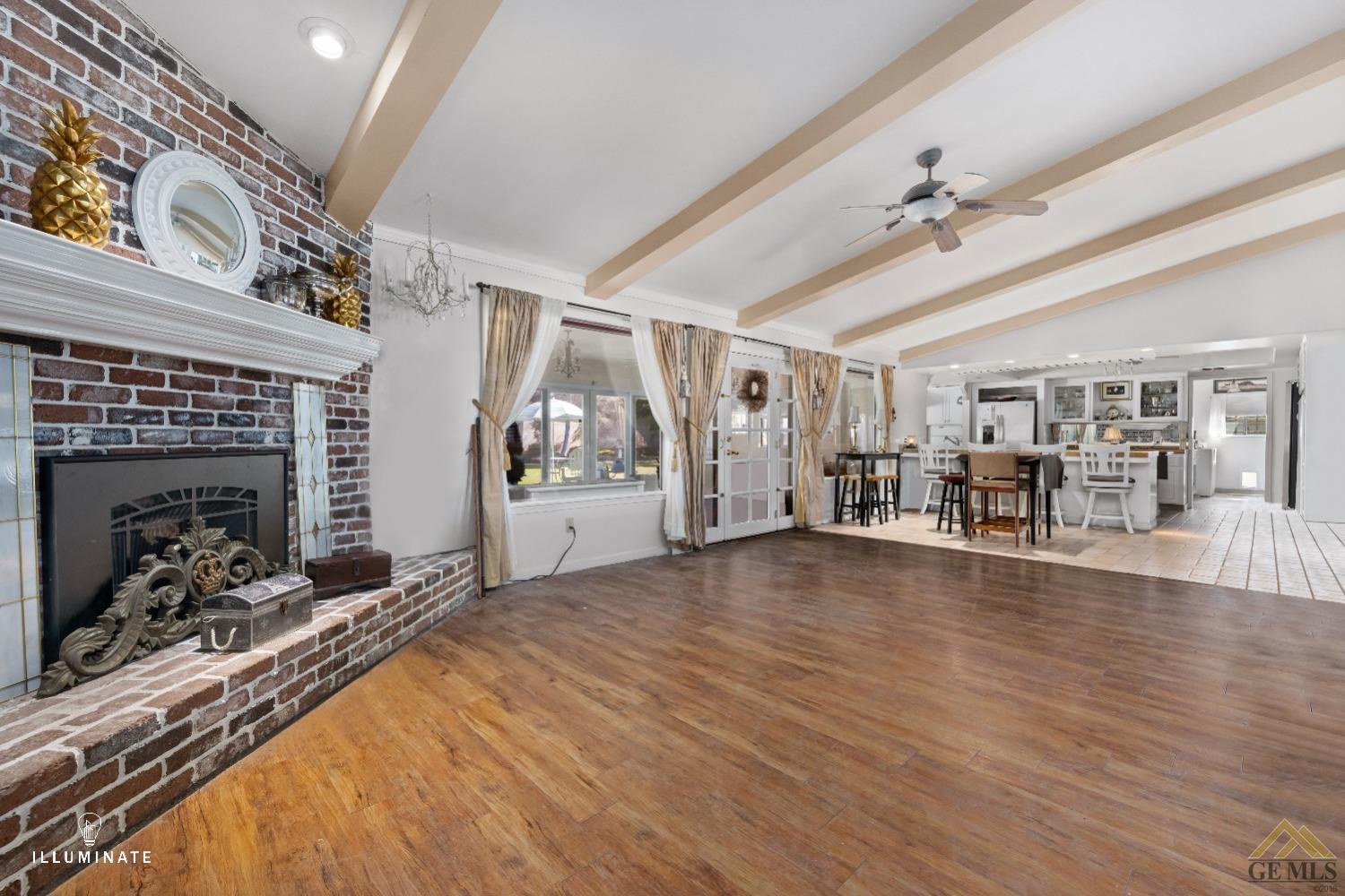 Undisclosed Address Bakersfield, CA 93311 - Photo 3 of 14 a view of a livingroom with hardwood floor and a ceiling fan
