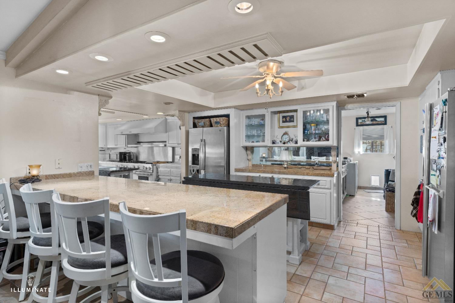 Undisclosed Address Bakersfield, CA 93311 - Photo 5 of 14 a large kitchen with a table and chairs