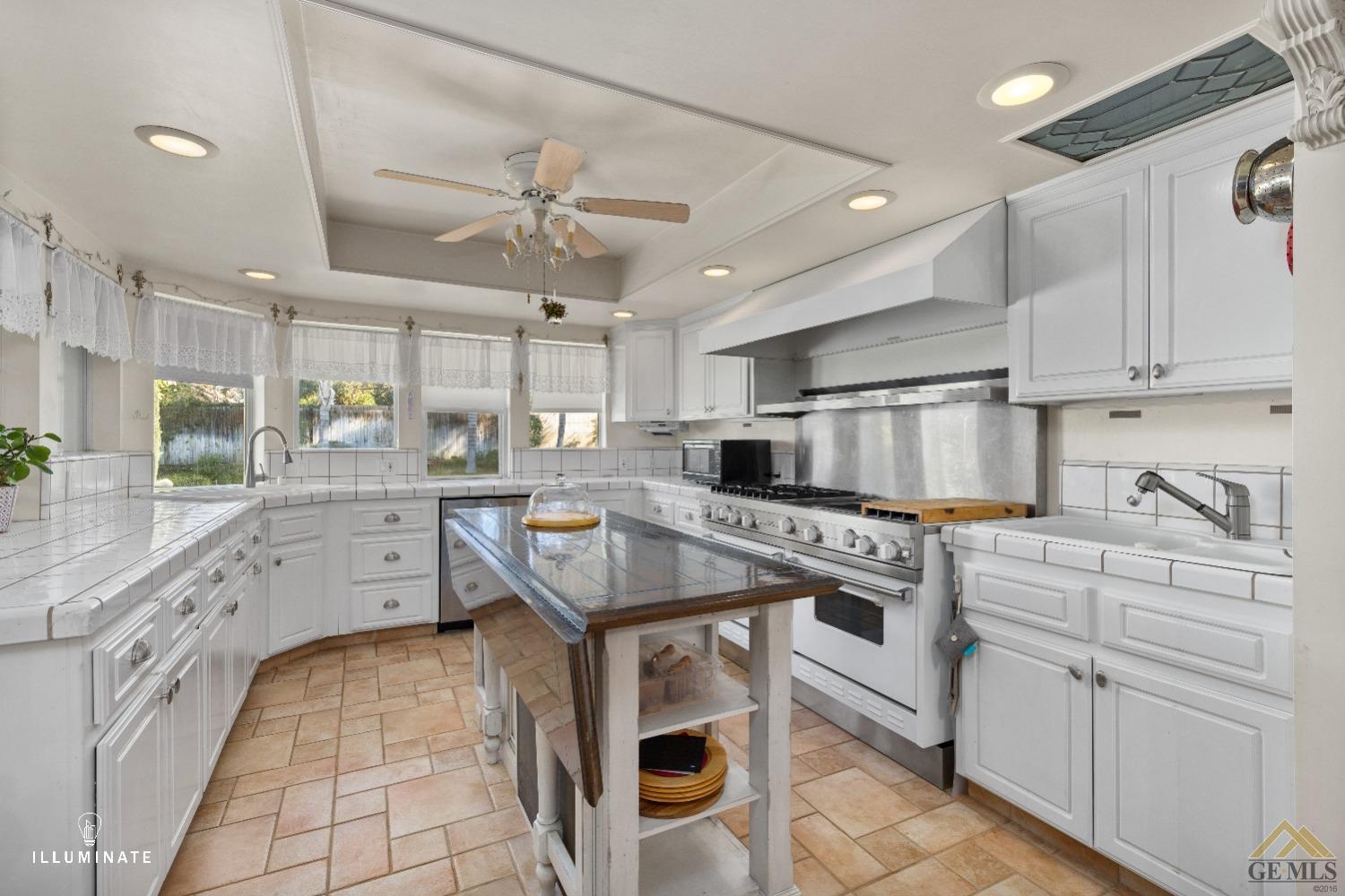Undisclosed Address Bakersfield, CA 93311 - Photo 6 of 14 a kitchen with stainless steel appliances granite countertop a sink and cabinets