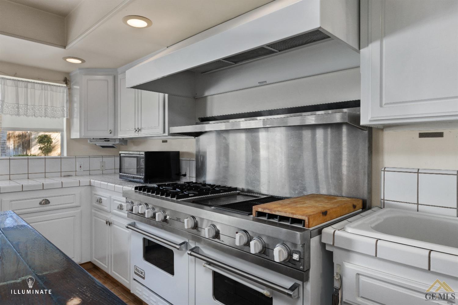 Undisclosed Address Bakersfield, CA 93311 - Photo 7 of 14 a kitchen with a stove and a sink