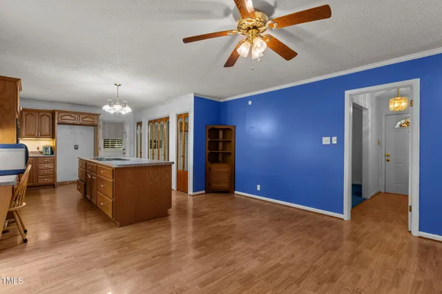 a view of a livingroom with furniture and a ceiling fan
