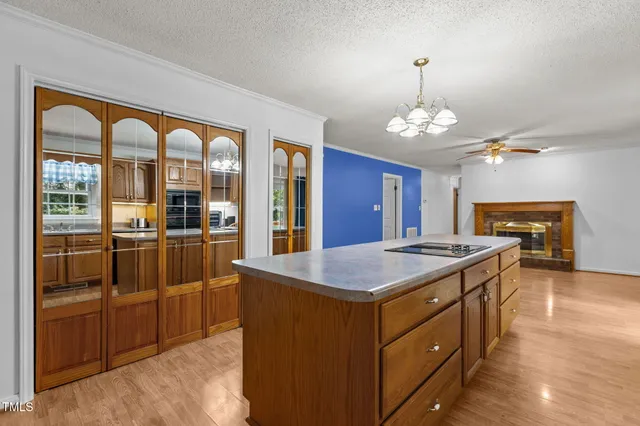a kitchen with stainless steel appliances granite countertop a stove and a refrigerator