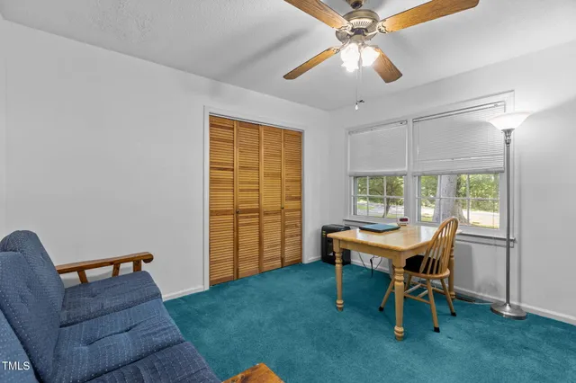 a workspace with furniture and a window