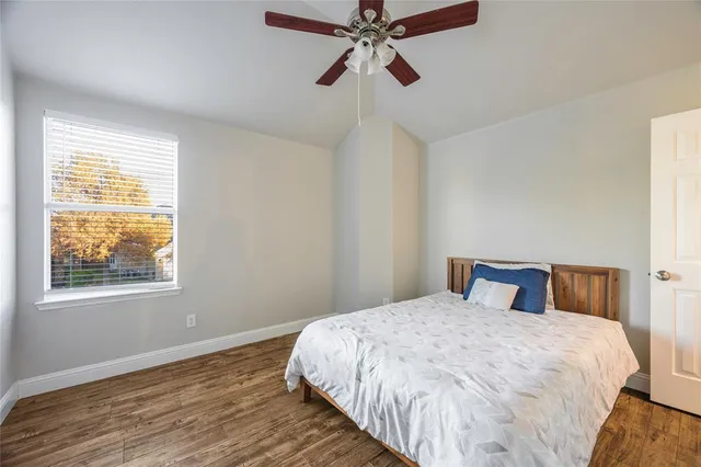 a bedroom with a bed and window