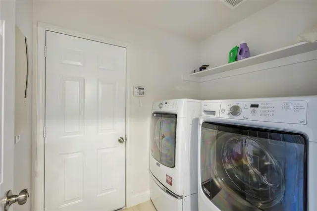 a utility room with dryer and washer