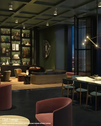 a room with furniture pool table and chairs