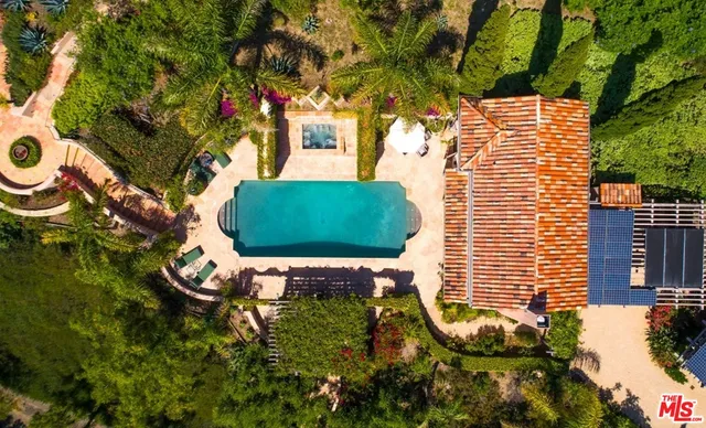 a kitchen with a sink a stove and a window