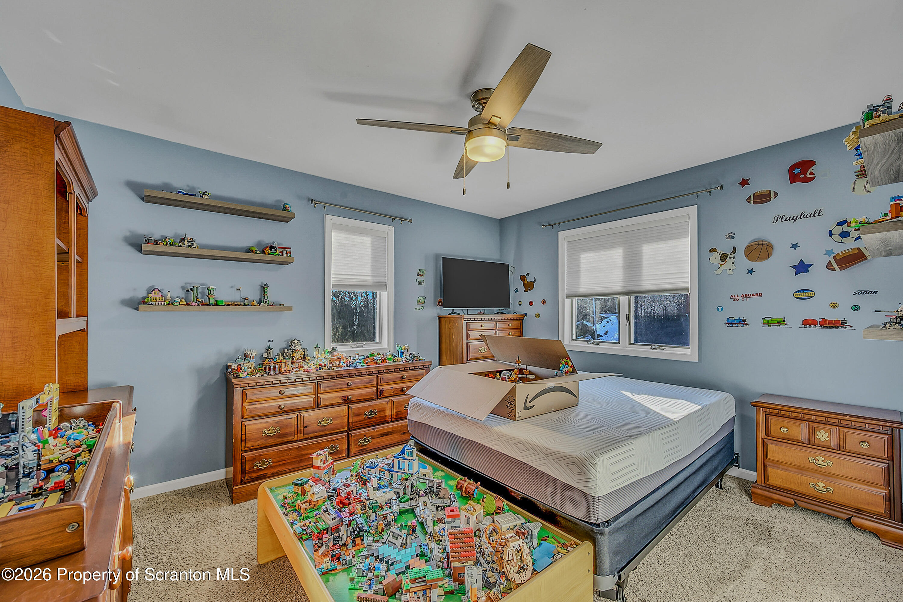 102 Glenstone Road Dickson City, PA 18519 - Photo 14 of 39 a living room with furniture and a flat screen tv