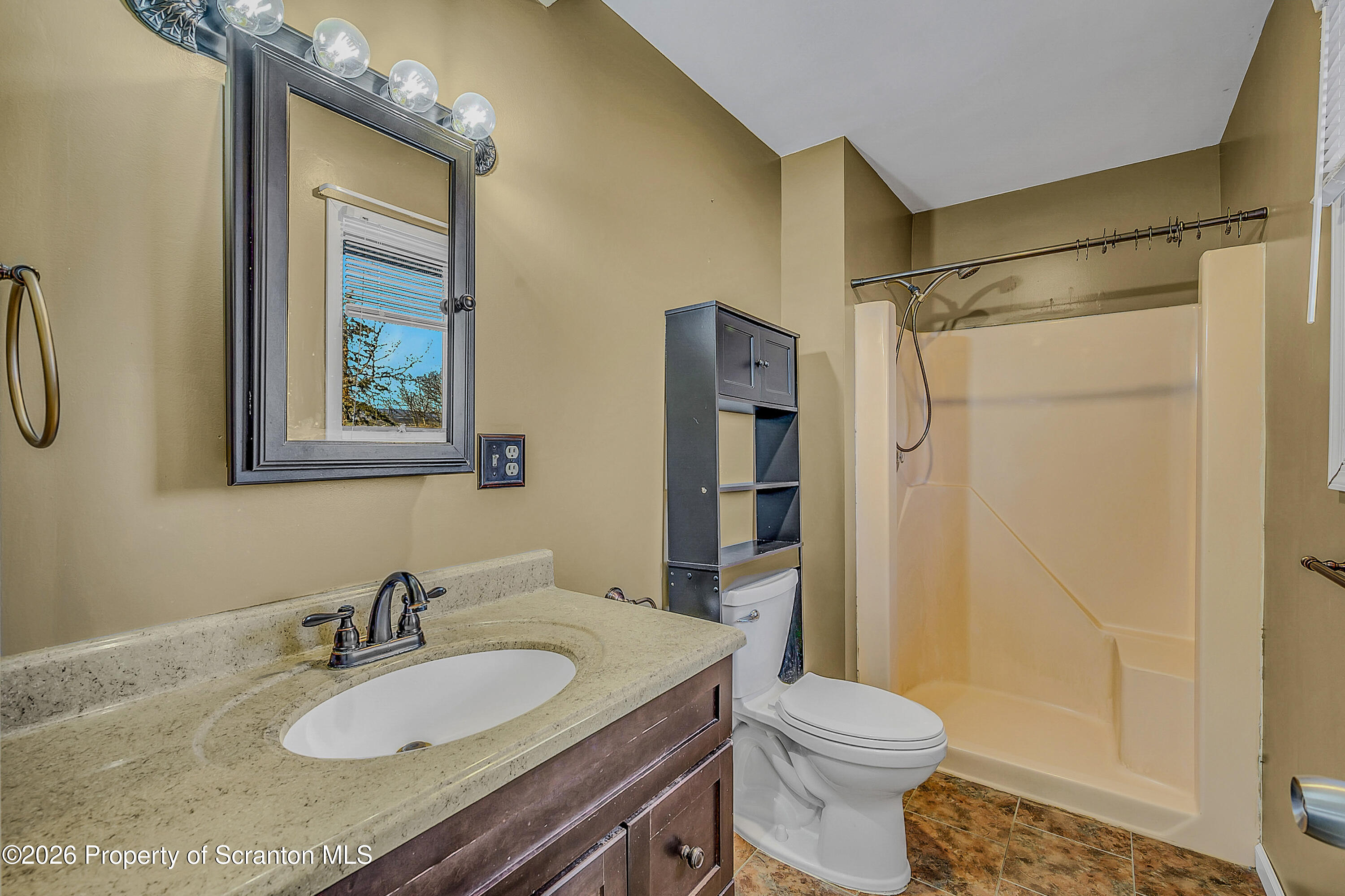 102 Glenstone Road Dickson City, PA 18519 - Photo 16 of 39 a bathroom with a granite countertop sink toilet and shower