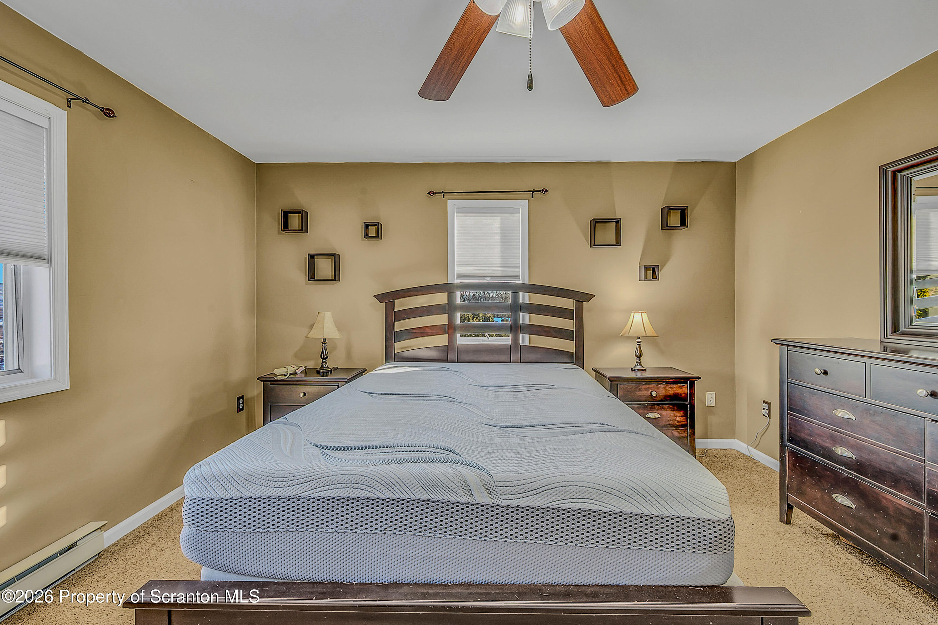 102 Glenstone Road Dickson City, PA 18519 - Photo 18 of 39 a bedroom with a large bed and a dresser
