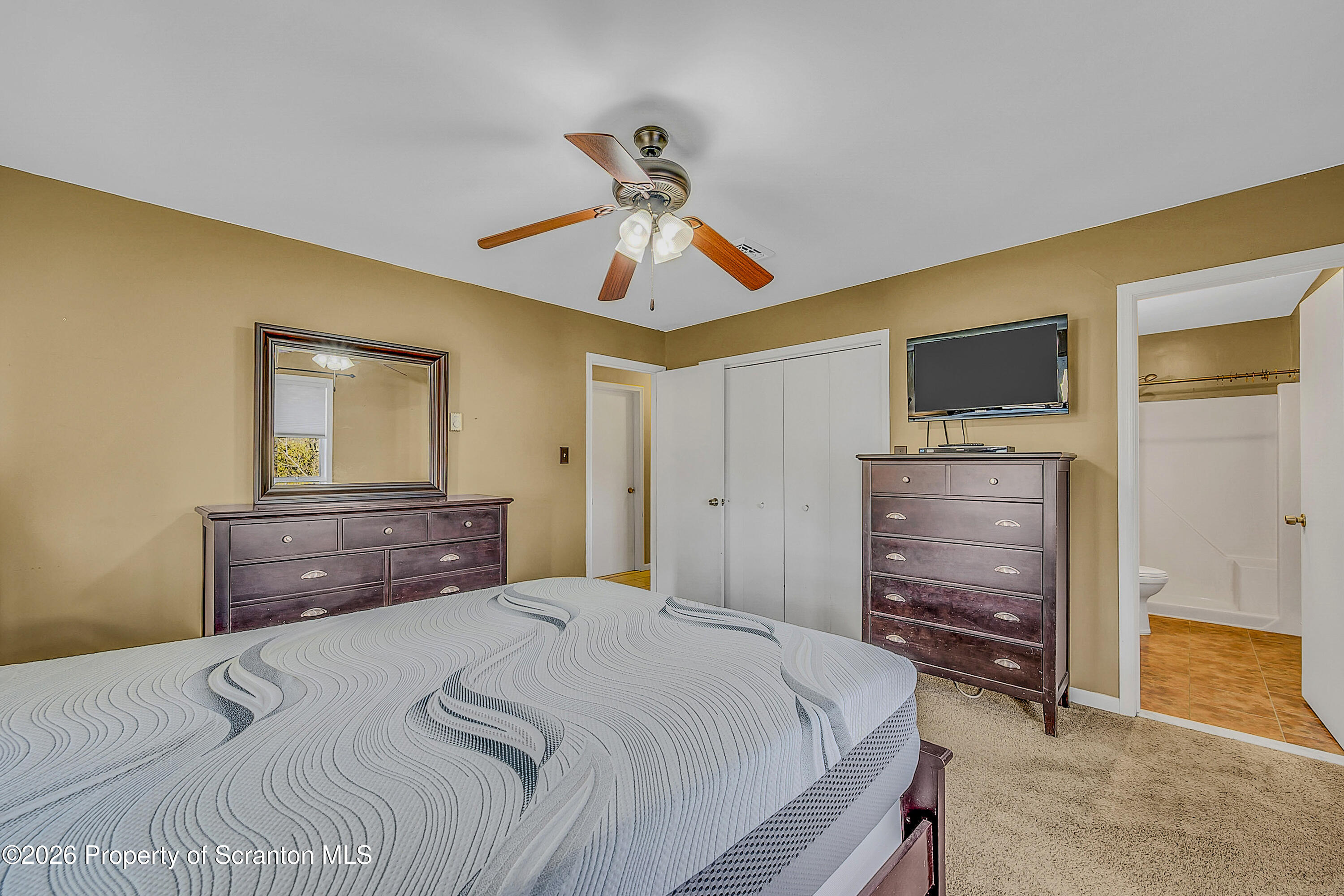 102 Glenstone Road Dickson City, PA 18519 - Photo 19 of 39 a bedroom with a bed and a dresser