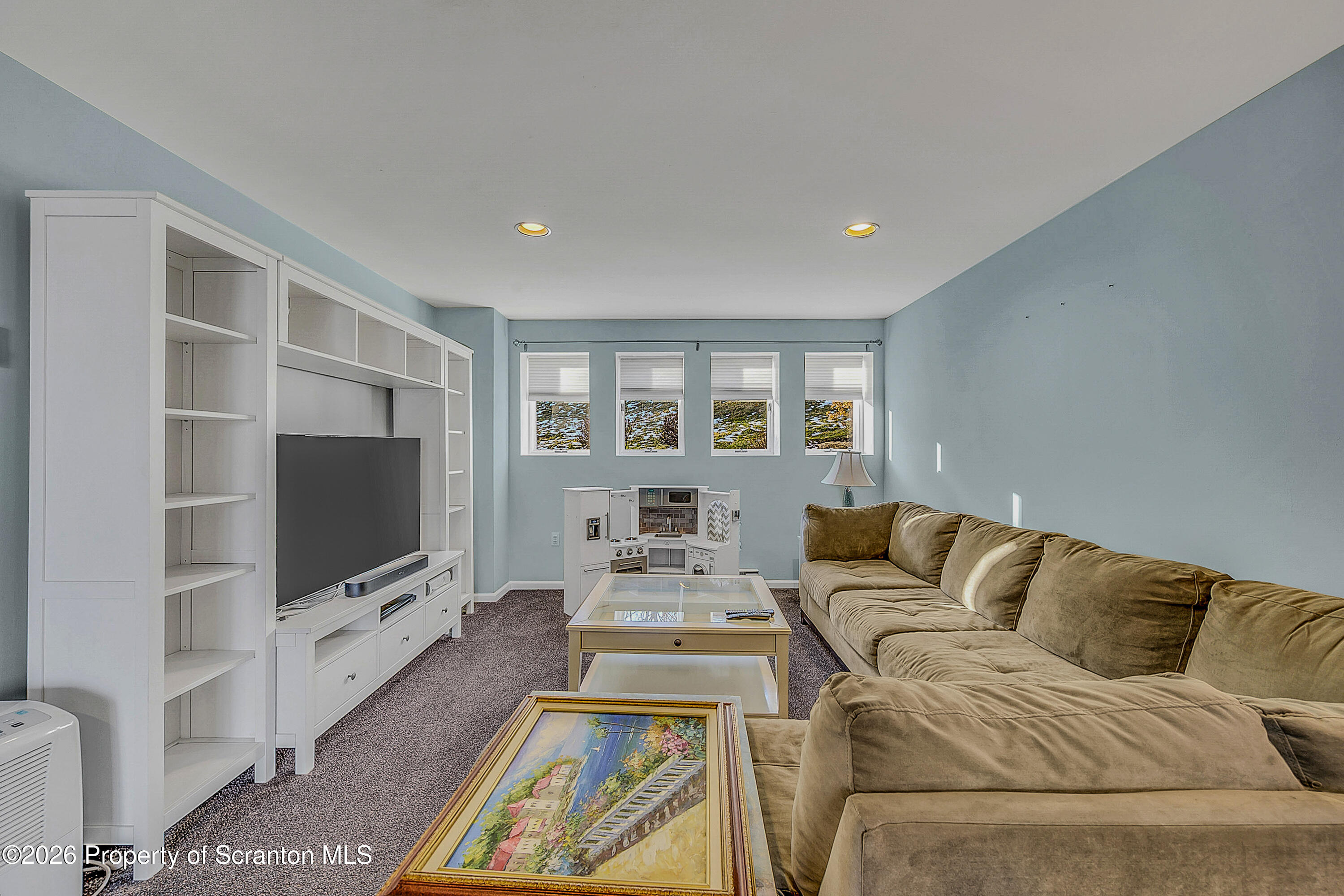 102 Glenstone Road Dickson City, PA 18519 - Photo 20 of 39 a living room with furniture and a flat screen tv
