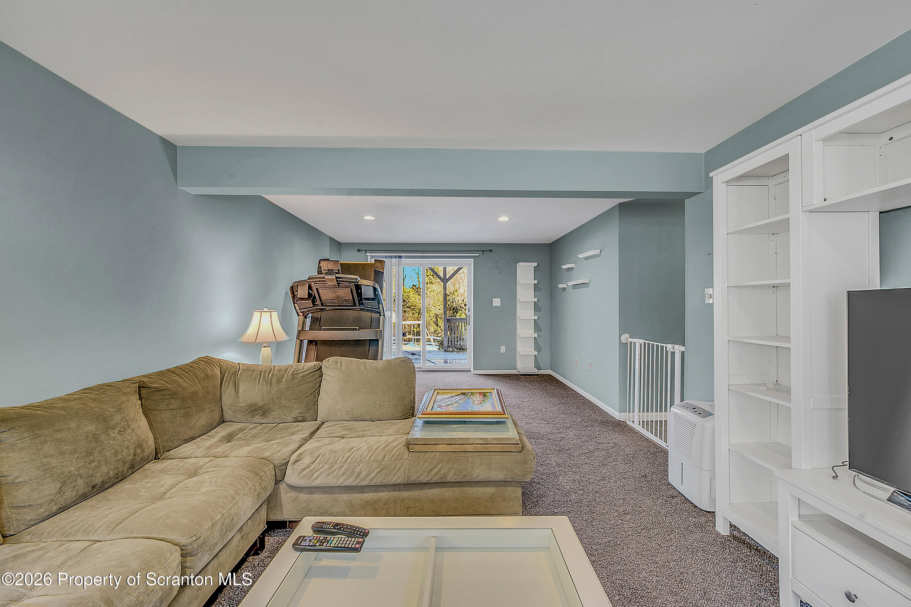 102 Glenstone Road Dickson City, PA 18519 - Photo 21 of 39 a living room with furniture and a flat screen tv