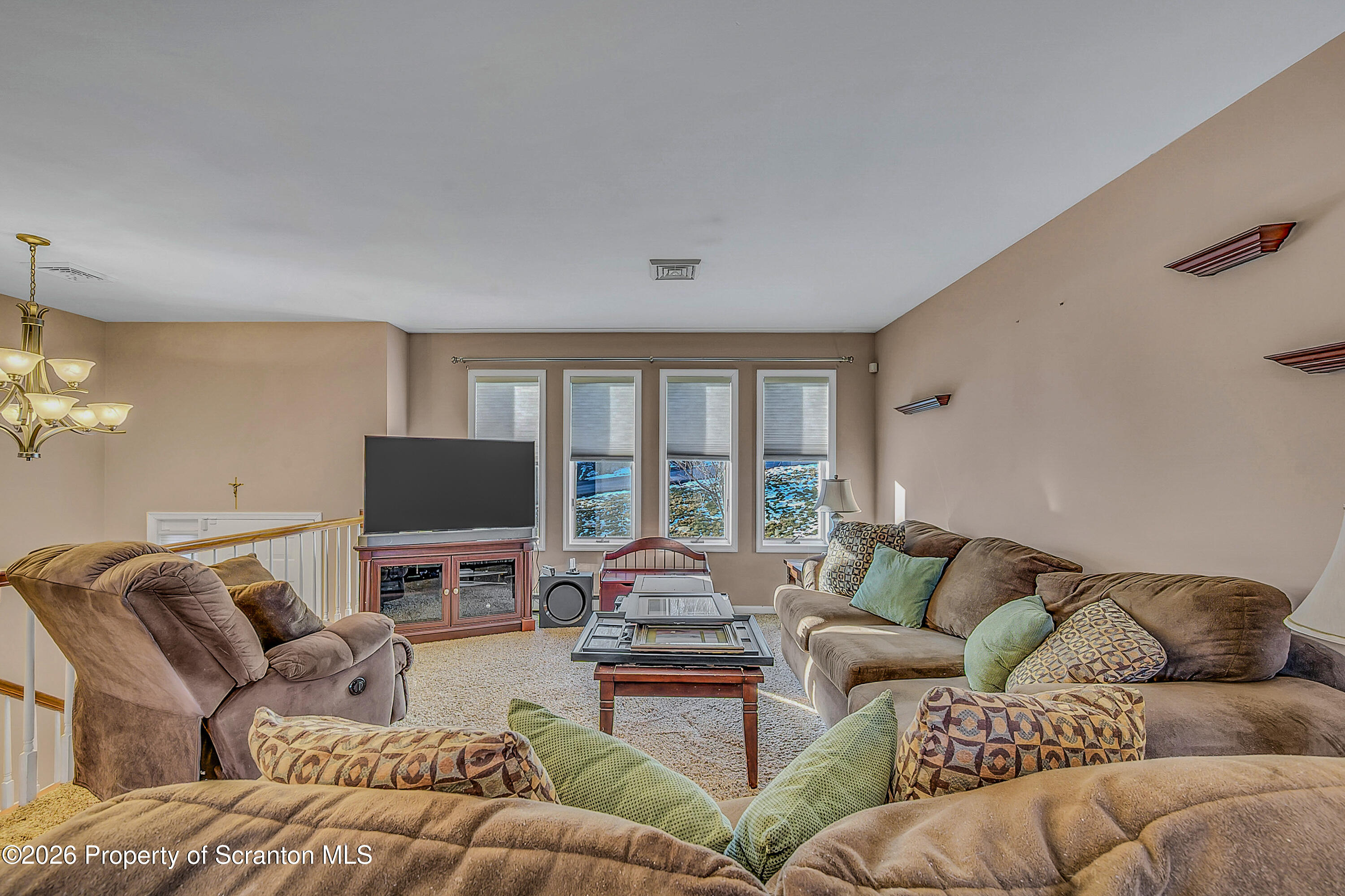 102 Glenstone Road Dickson City, PA 18519 - Photo 3 of 39 a living room with furniture and a flat screen tv
