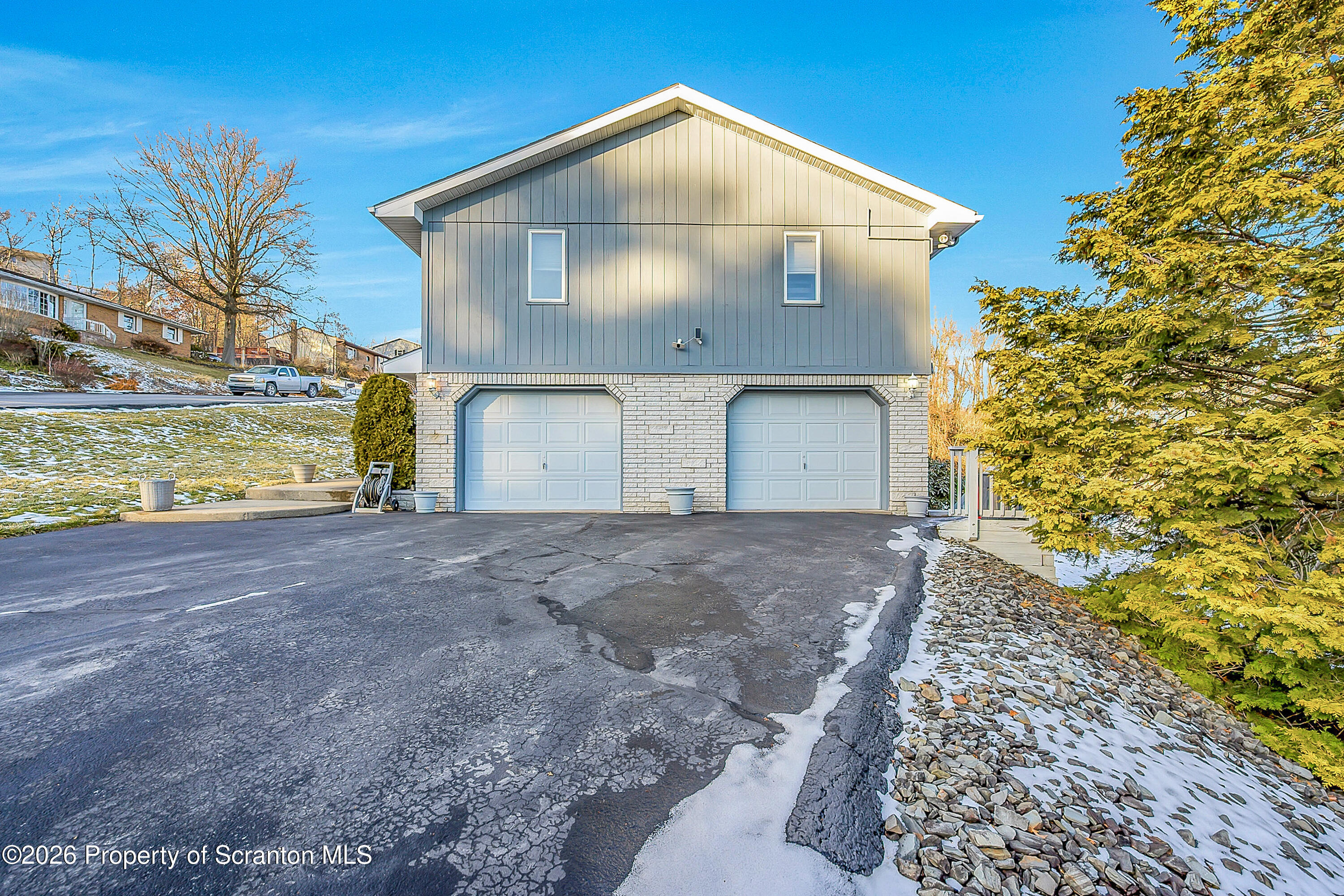 102 Glenstone Road Dickson City, PA 18519 - Photo 32 of 39 a view of a house with a yard and garage