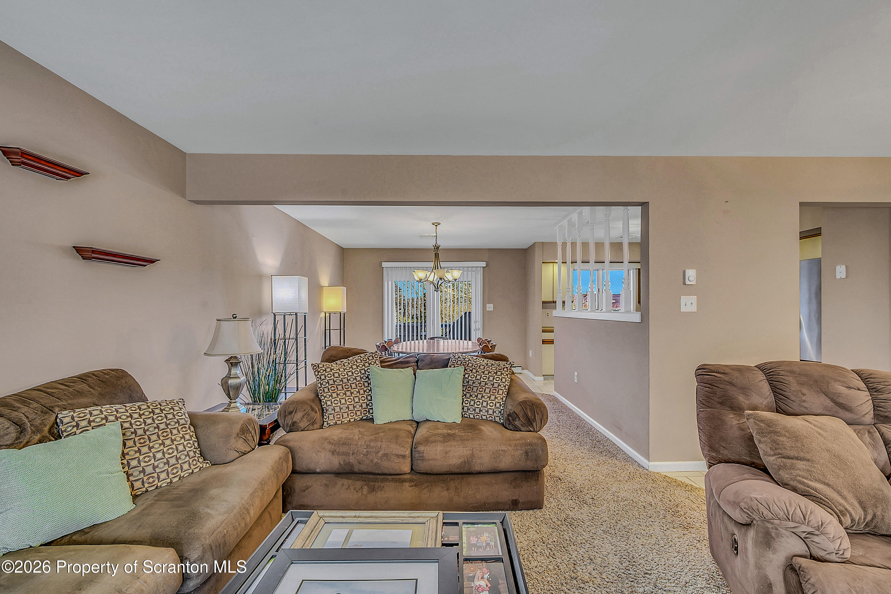 102 Glenstone Road Dickson City, PA 18519 - Photo 4 of 39 a living room with furniture and a large window