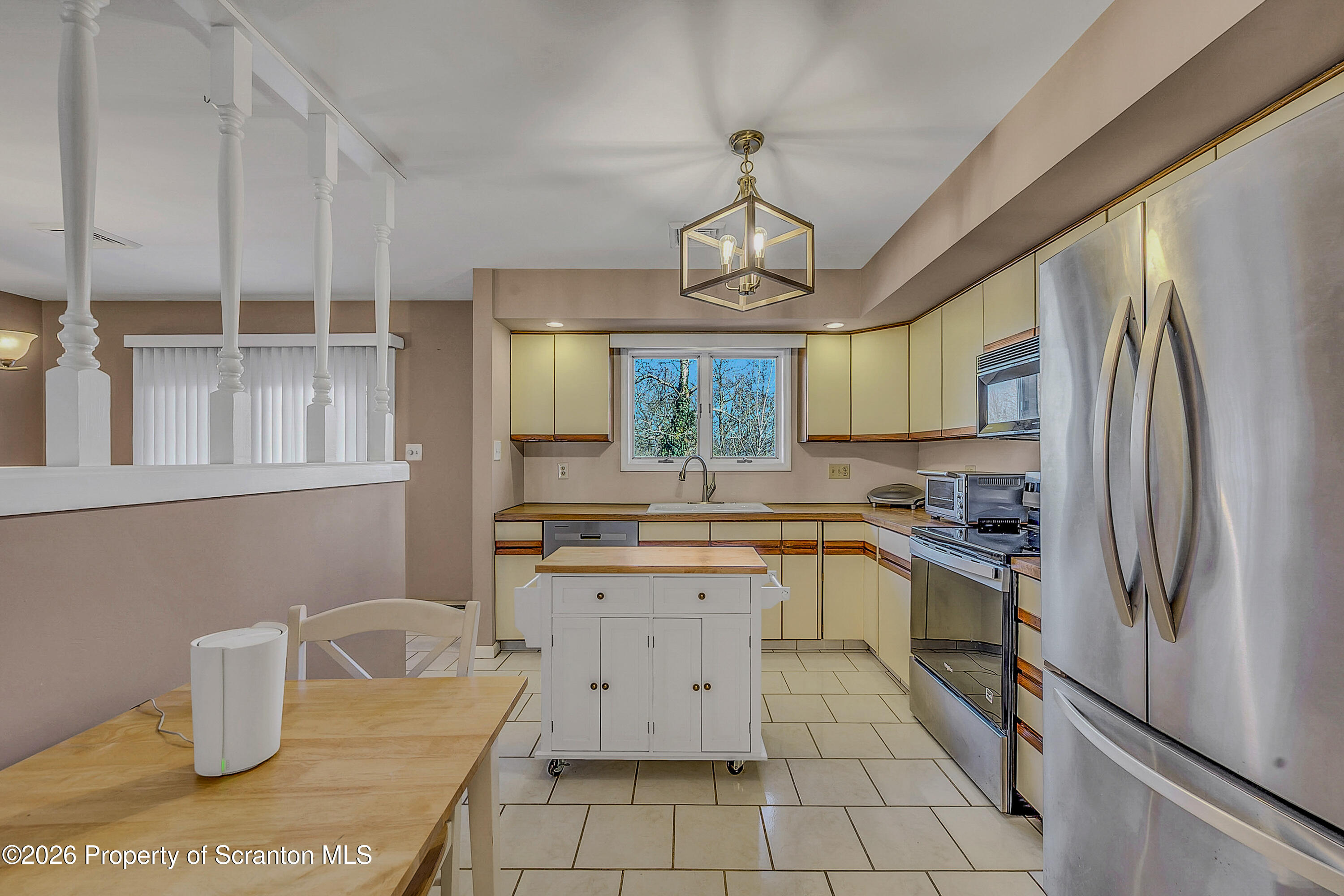 102 Glenstone Road Dickson City, PA 18519 - Photo 6 of 39 a kitchen with a stove a sink and a refrigerator