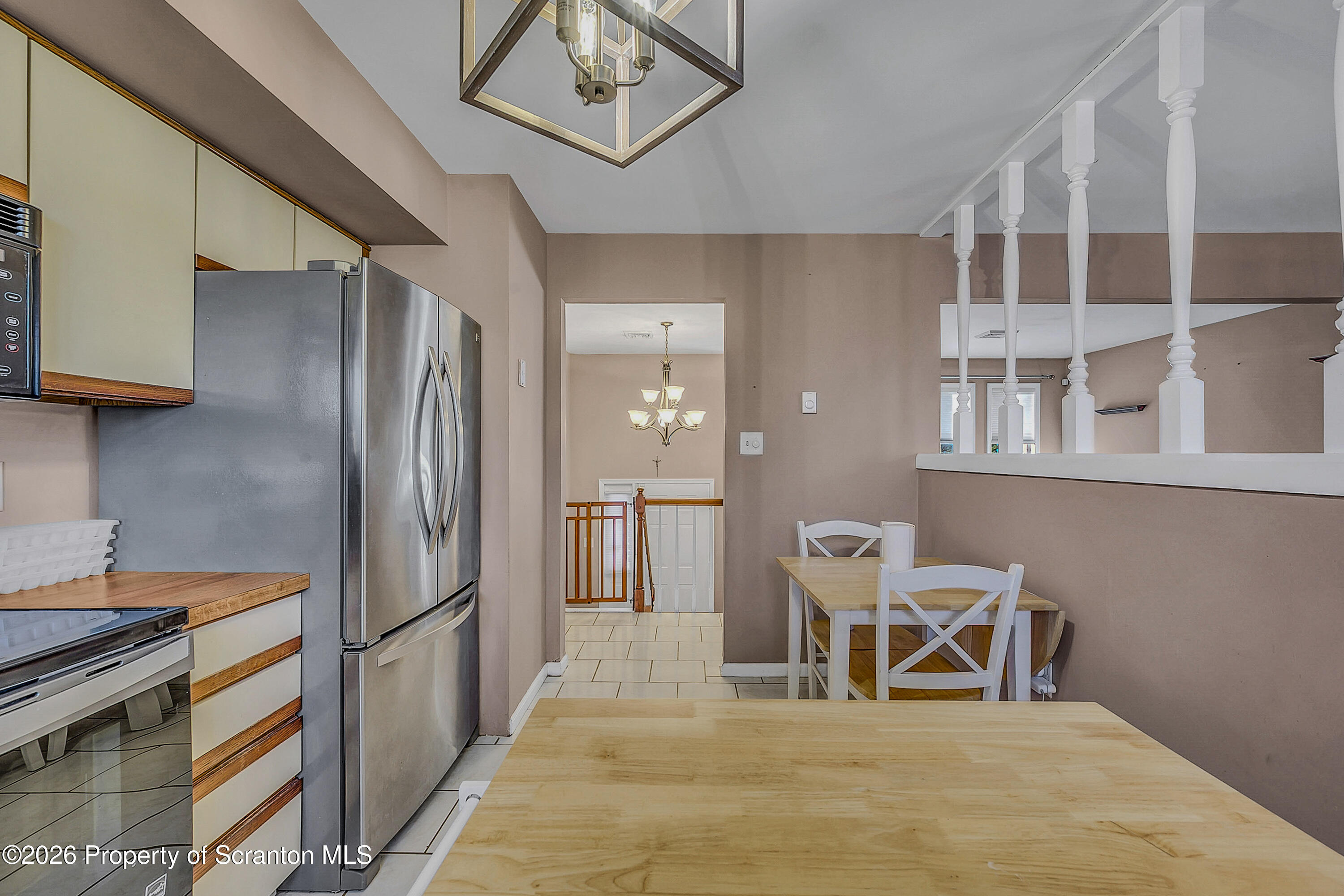 102 Glenstone Road Dickson City, PA 18519 - Photo 7 of 39 a kitchen with stainless steel appliances a refrigerator and a stove top oven