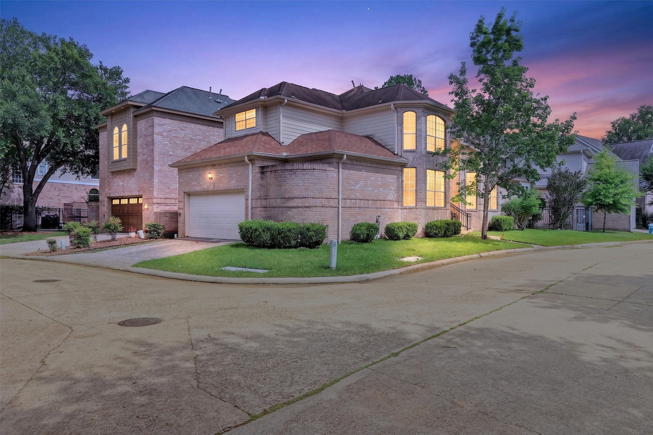 12929 Kingsbridge Lane Houston, TX 77077 - Photo 4 of 42 Welcome home to this beautifully maintained corner-lot property offering exceptional curb appeal and an elegant two-story design. Nestled on a quiet street, this home features large windows, abundant natural light, and a spacious layout perfect for both everyday living and entertaining. Buyers will love the oversized garage, mature landscaping, and inviting exterior with timeless brick architecture. Conveniently located near shopping, dining, parks, and major commuter routes, this move-in ready home.