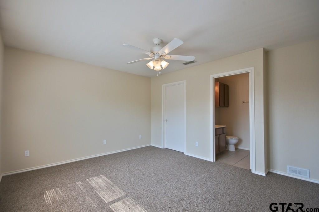 609 Hagan Road Whitehouse, TX 75791 - Photo 14 of 28 a view of an empty room with a ceiling fan