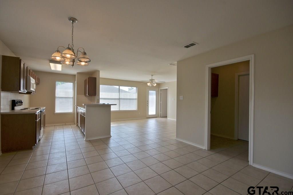 609 Hagan Road Whitehouse, TX 75791 - Photo 4 of 28 a view of a room with window and chandelier