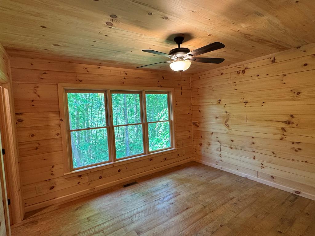 639 North Moreland Drive Blue Ridge, GA 30513 - Photo 49 of 53 wooden floor in an empty room with a window