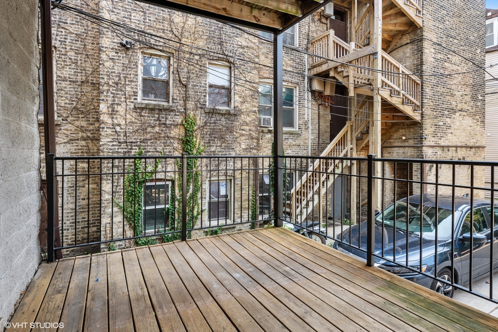 3404 North Seminary Avenue, Unit 1 Chicago, IL 60657 - Photo 15 of 15 a view of a balcony with wooden floor