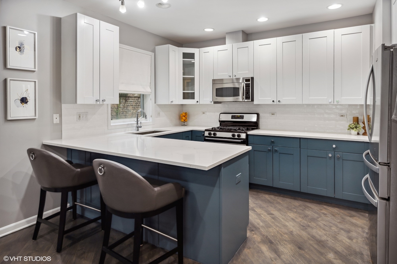 3404 North Seminary Avenue, Unit 1 Chicago, IL 60657 - Photo 3 of 15 a kitchen with stainless steel appliances granite countertop a table chairs sink and cabinets