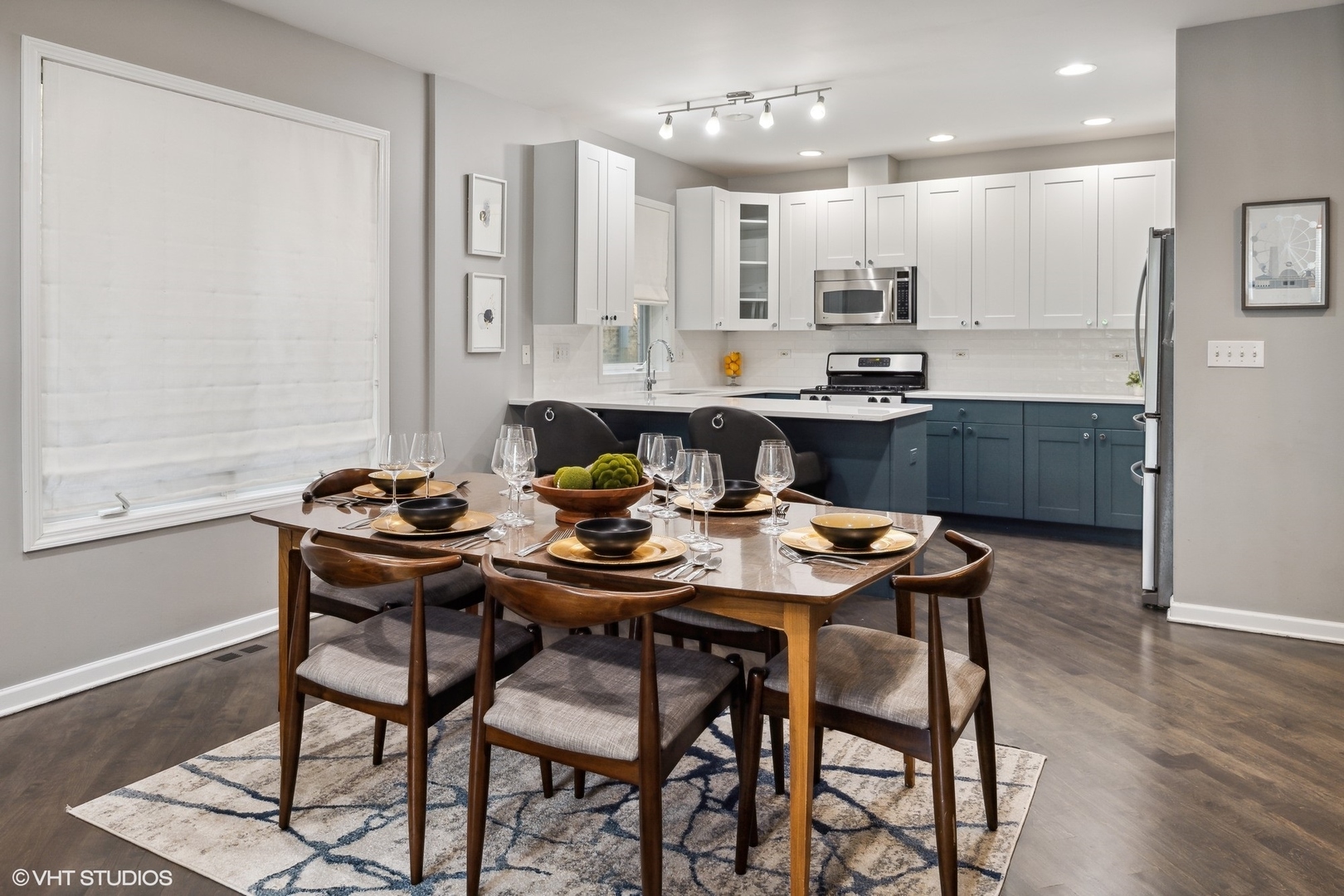 3404 North Seminary Avenue, Unit 1 Chicago, IL 60657 - Photo 5 of 15 a kitchen with a table and chairs in it
