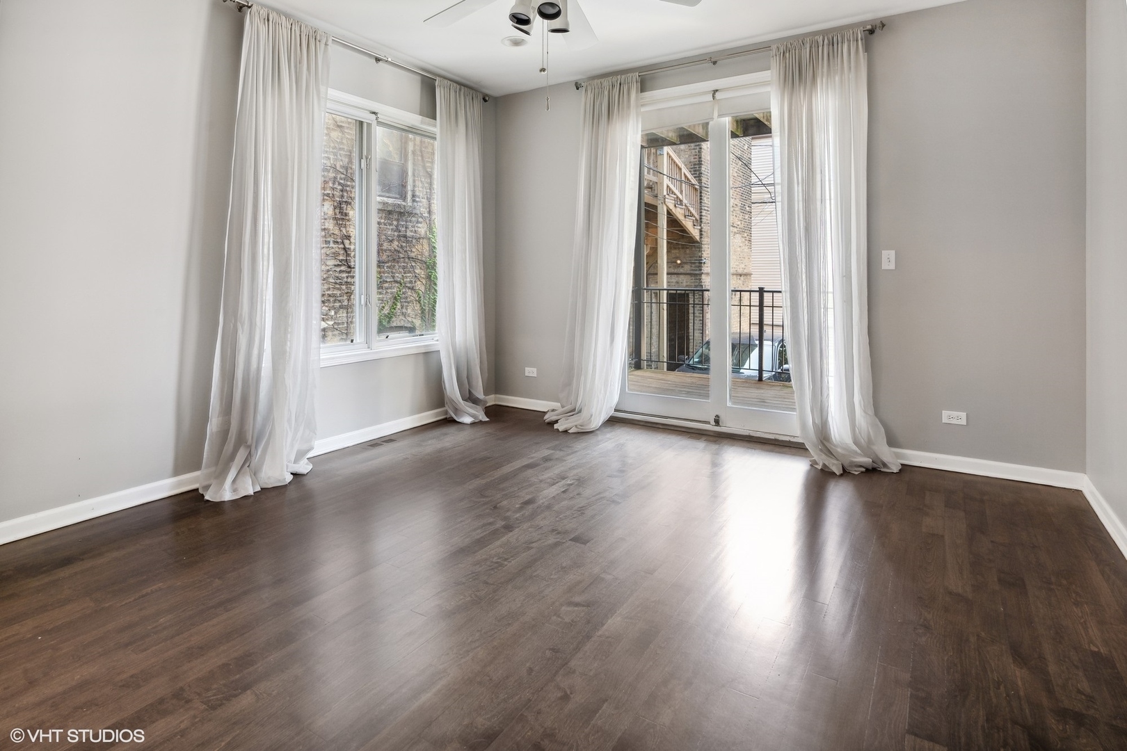 3404 North Seminary Avenue, Unit 1 Chicago, IL 60657 - Photo 7 of 15 an empty room with wooden floor and windows