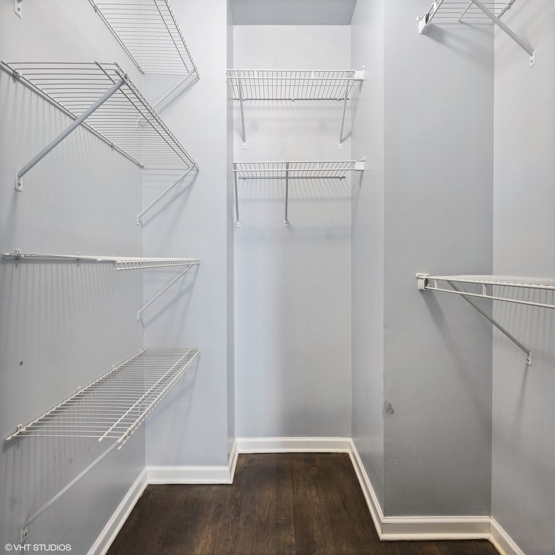 3404 North Seminary Avenue, Unit 1 Chicago, IL 60657 - Photo 9 of 15 a view of walk in closet with empty racks