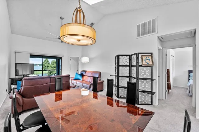 a bedroom with a bed dresser and a large mirror