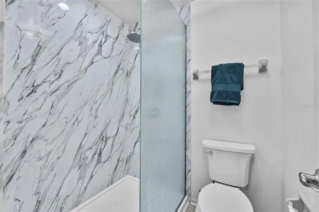 a front view of a house with a garden and a yard